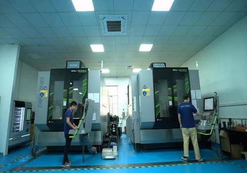 Engineer Programming the Control Panel of Precision 5-Axis Machining Center
